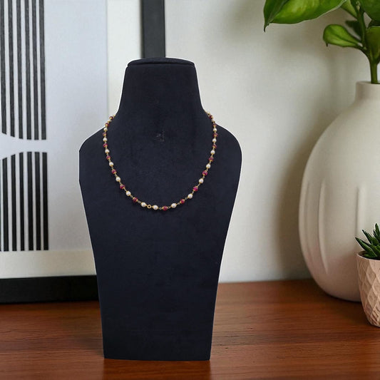 “Pearl and Ruby Beaded Necklace”.