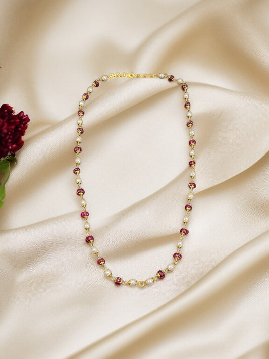 “Pearl and Ruby Beaded Necklace”.